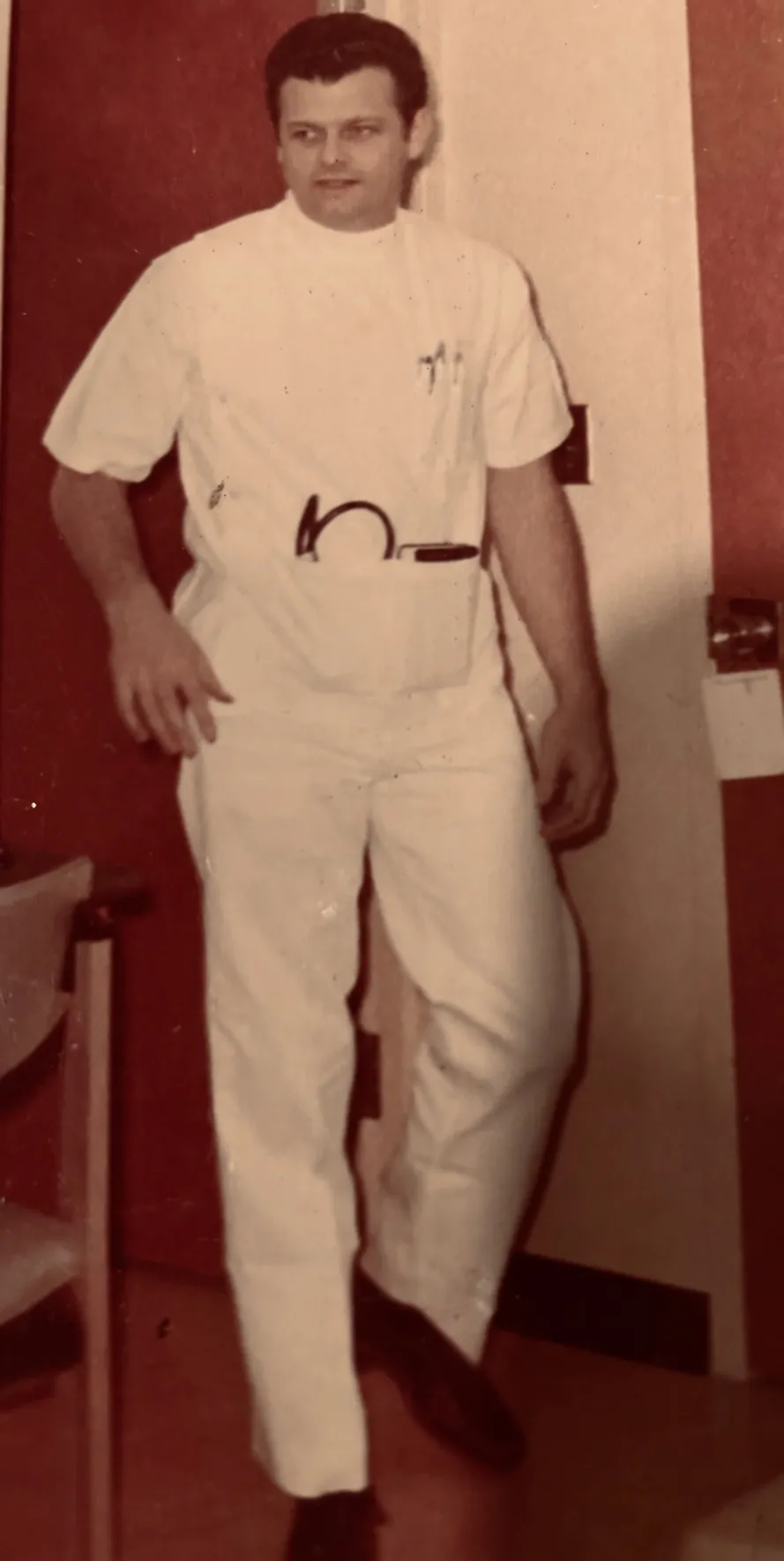 Photograph of Dr. Richard Guttler wearing medical whites.